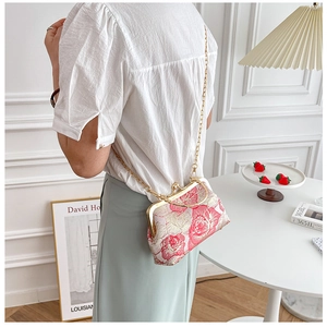 Mini floral cheongsam crossbody bag with pink roses and golden chain strap detail