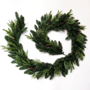 Artificial Christmas garland with pine cones and green needles for holiday home decoration