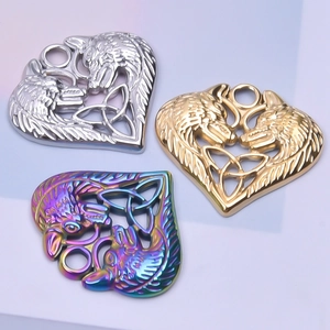 Viking heart pendant with double wolf head design in gold silver and rainbow finishes