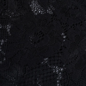 Close-up of intricate black floral lace pattern with delicate hollow-out embroidery detail