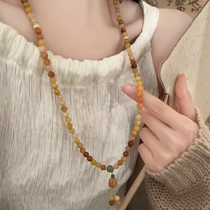 Handcrafted lily of the valley multi-layer crystal bead necklace with golden tassels