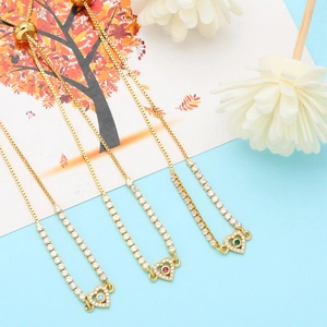 Detail of adjustable heart bracelets with colorful stones and sparkling zircon stones