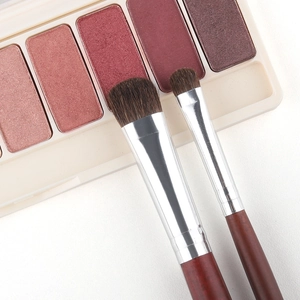 Detail of horse hair eyeshadow brushes with wooden handles and dense bristles for blending