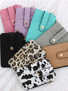 Collection of faux leather card holders with snap closure in solid colors and animal prints