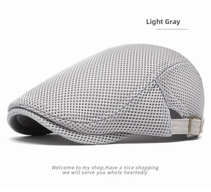 Detail of light gray mesh flat cap showing breathable texture and metal side buckle