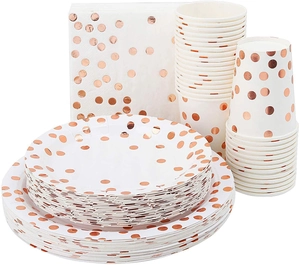 Detailed set of white party tableware with metallic rose gold polka dots on plates and cups