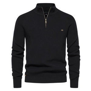 Detailed view of black knitted sweater featuring a stand collar and metallic half-zipper