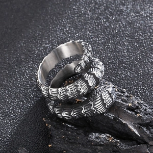 Macro detail of retro dark punk snake-style stainless steel ring with textured scales