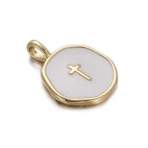 Detail of a golden cross pendant with white enamel inlay and polished metal hanging loop