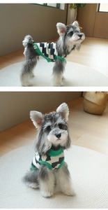Detail of dog checkerboard knit sweater with green ribbed neck and cuff textures