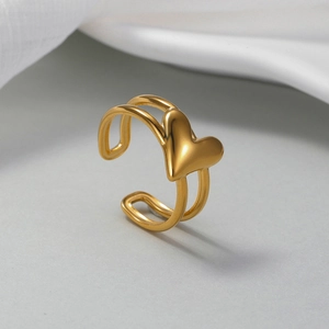 Macro detail of 18K gold-plated double-band heart ring with adjustable open design