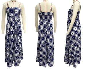 Detail view showing elastic shirred back of the blue and white floral maxi dress