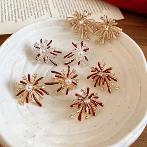 Elegant silver needle firework earrings with enamel and zircon on a ceramic plate