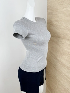 Detail view of grey slim fit crew neck t-shirt with ribbed knit texture on a mannequin