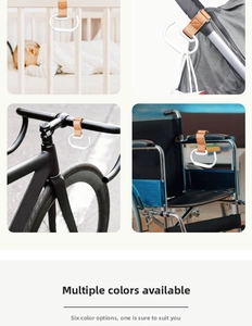 Universal stroller hook detail showing brown leather strap with durable metal carabiner