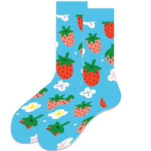 Detail of blue crew socks featuring cute cartoon red strawberry and white flower patterns