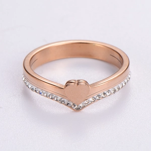 Elegant rose gold heart ring with pavé cubic zirconia accents on a minimalist band