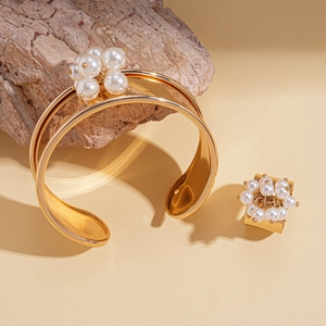 Two-piece gold metal jewelry set with floral pearl cluster cuff bracelet and open ring