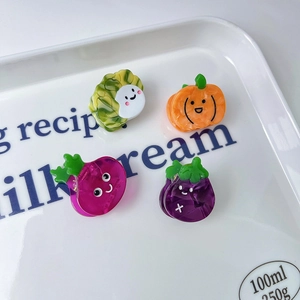 Set of four cute acetate fruit and vegetable hair claws with cartoon smiley faces