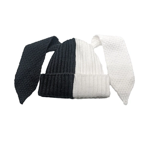 Detailed knit texture of the black and white contrast rabbit long ear beanie hat