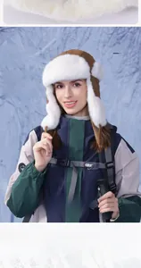 Close-up of winter trapper hat with white faux fur lining and ear protection flaps