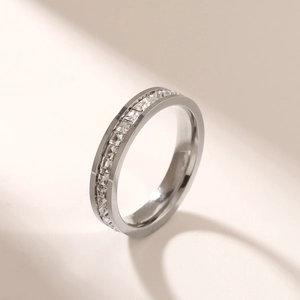 Close-up of polished silver stainless steel ring featuring brilliant row-set cubic zirconia
