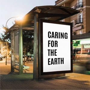 Detailed view of 5-inch adhesive vinyl letters on a city bus stop light box at night