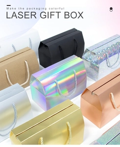 Macro shot of assorted colorful laser gift boxes with rope handles and metallic finish