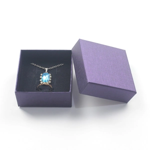 Elegant purple jewelry gift box set with blue gemstone necklace and silver ring