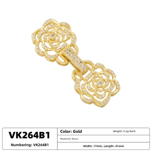 Macro shot of rose flower jewelry clasp in gold brass with white cubic zirconia pavé