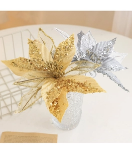 Close-up of gold and silver glitter artificial poinsettia flowers for Christmas wreath decor