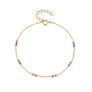 Detail of gold box chain bracelet with six rectangular purple crystals and lobster clasp