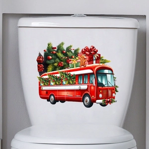 Detail view of a festive red Christmas bus wall sticker applied on a white ceramic surface