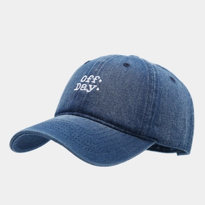 Close-up of premium denim baseball cap featuring white Off Day 3D letter embroidery