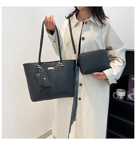 Detailed set of black lychee grain leather tote bag with matching zipper pouch and card holder