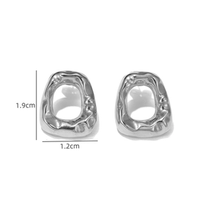 Detail view of silver irregular liquid lava texture earrings with dimensions of 1.9cm and 1.2cm