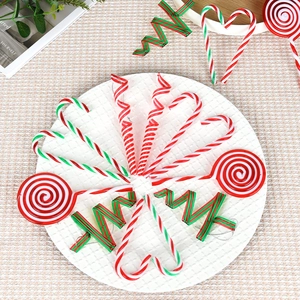 Christmas tree ornaments set with red white green candy canes and lollipops on tray
