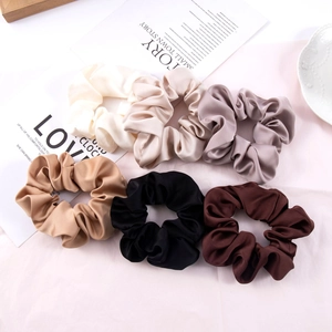 6-piece large satin silk hair scrunchies set in neutral tones on decorative background