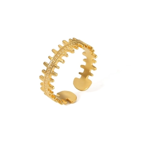 Detailed view of a gold fishbone-shaped adjustable stainless steel ring with polished finish