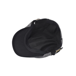 Detail view of cotton beret inner lining and adjustable metal buckle on the back
