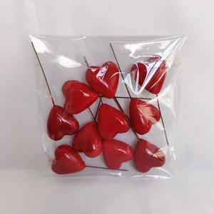 Pack of 10 shiny red heart cake toppers with thin metal rods for DIY flower arrangements