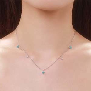 Elegant S925 sterling silver necklace with turquoise beads worn on a female model