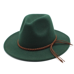 Detailed side view of dark green wool fedora hat with brown braided tassel leather band