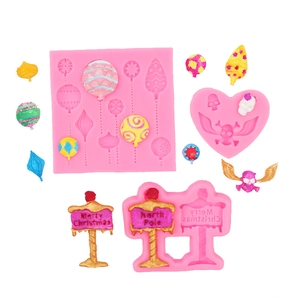 Pink silicone mold set for Christmas balloons and skull shapes with resin finished crafts
