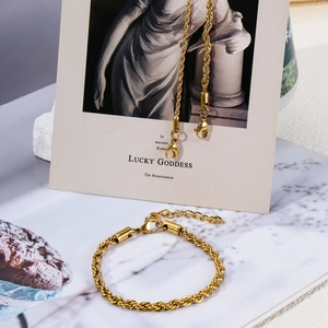 Close-up of 18k gold-plated stainless steel rope chain set with lobster clasp and extender