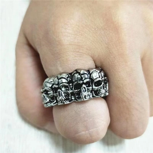 Vintage punk rock men's stainless steel ring with multiple silver skull heads design