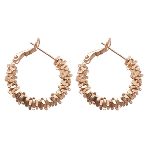 Irregular rose gold hoop earrings with silver needle and spiral metallic texture