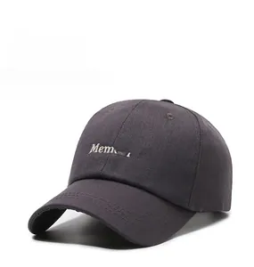Detail of Memorie letter embroidery on a dark gray washed cotton baseball cap