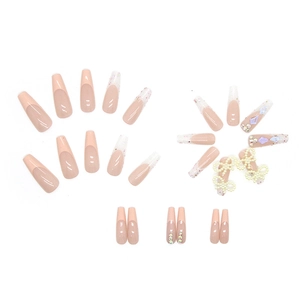 Sparkly pink French ballerina press-on nails with 3D pearl bows and rhinestones