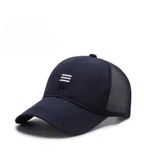 Detail of navy blue mesh baseball cap showing breathable rear net and white embroidery